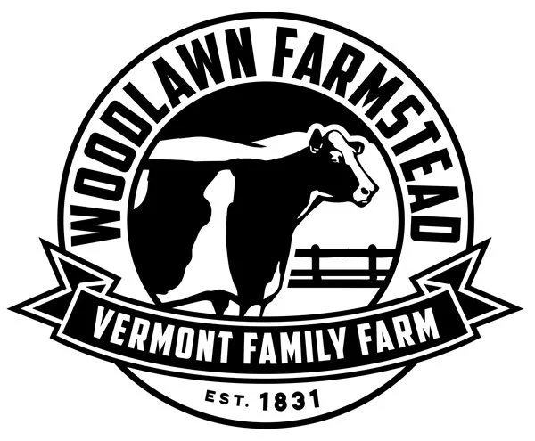 Logo for Woodlawn Farmstead, a Vermont family farm established in 1831, featuring a cow.